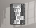 The Myth of sisyphus poster print featuring black geometric maze-like patterns and columns of small text on a white background, mounted on a light gray wall with soft window shadow overlays.